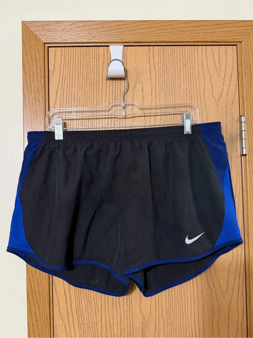 Nike Women's Black Shorts with Royal Blue Trim and Side Panels